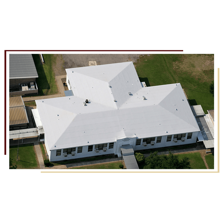 Gray asphalt roofing shingles on house with blue siding